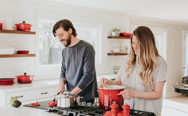 Couple cooking in kitchen